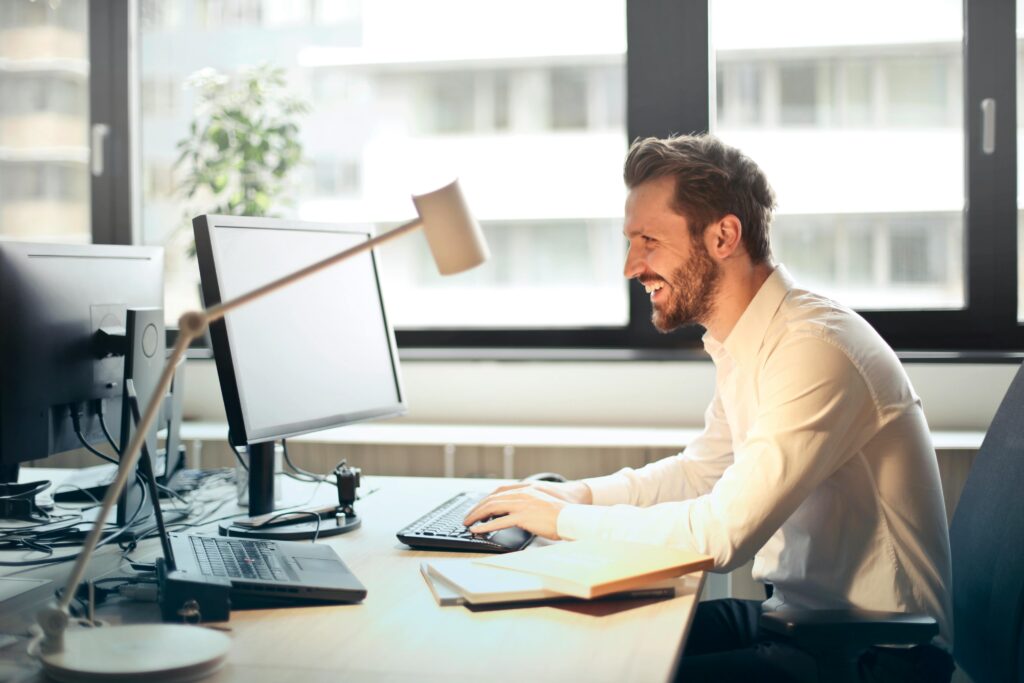 Real estate agent using a CRM on laptop to manage follow-ups and appointments